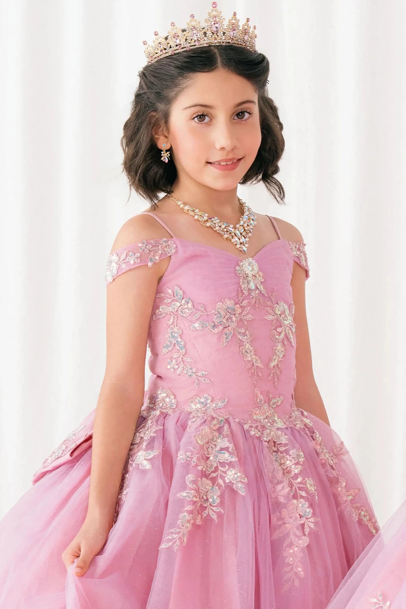Front close-up Dusty Rose mini quince off shoulder mini quince dress with embroidered bodice, gemstone accent, glitter tulle.