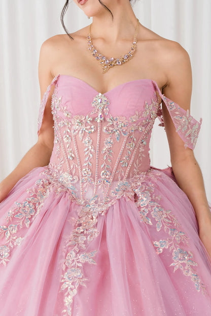 Front close-up view of Dusty Rose Off shoulder quinceañera ball gown with beaded corset, floral appliqués, layered tulle skirt, cathedral length train, and bow