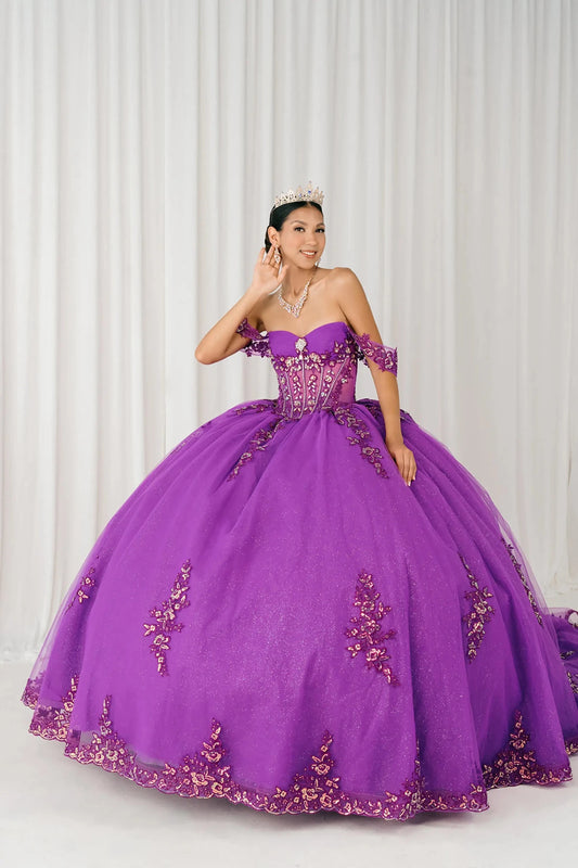 Front full-length view of Magenta Off shoulder quinceañera ball gown with beaded corset, floral appliqués, layered tulle skirt, cathedral length train, and bow