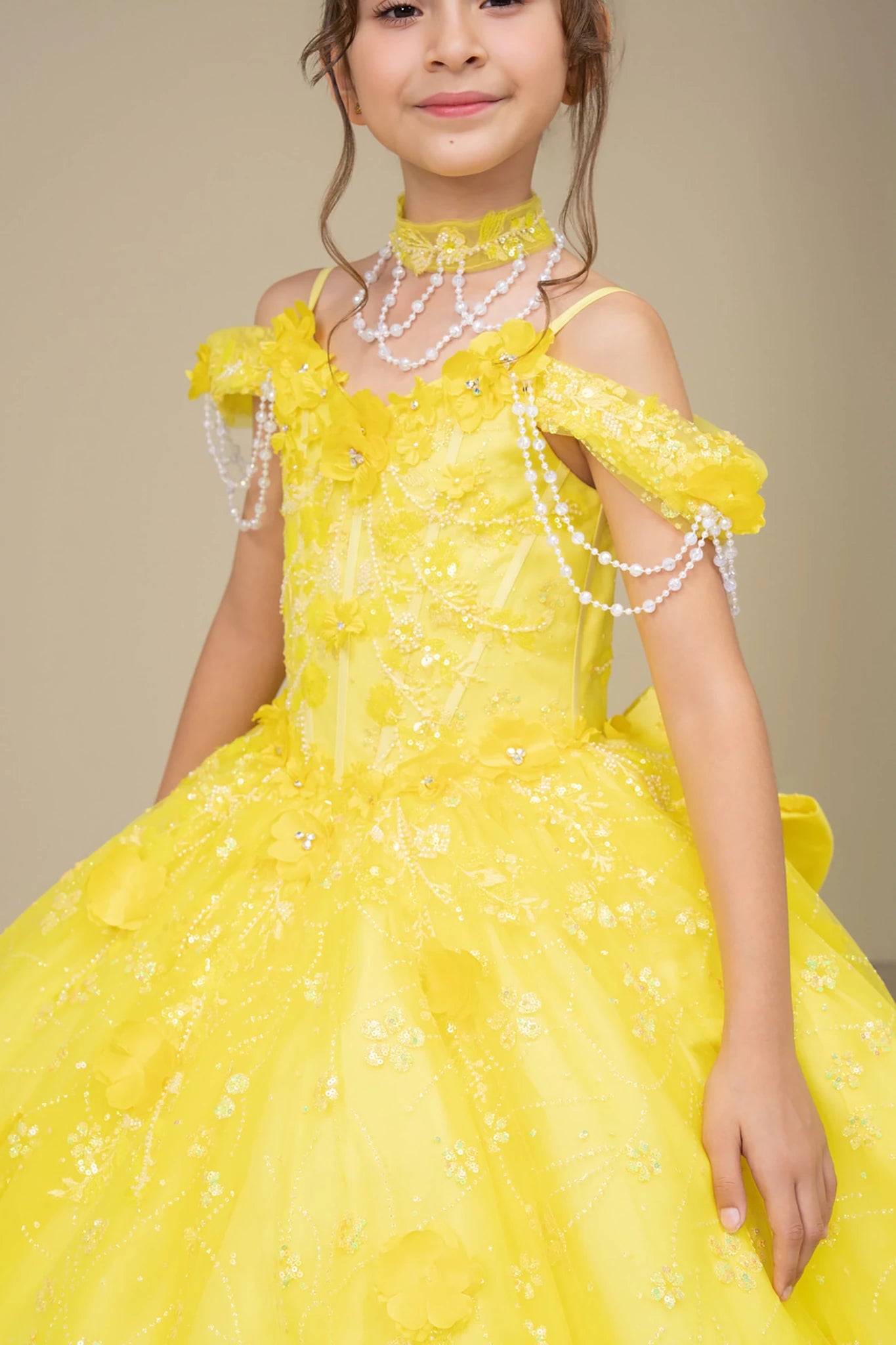 Yellow front view kids mini quinceañera mini quince dress with off-shoulder 3D floral applique, pearls and glitter tulle skirt.