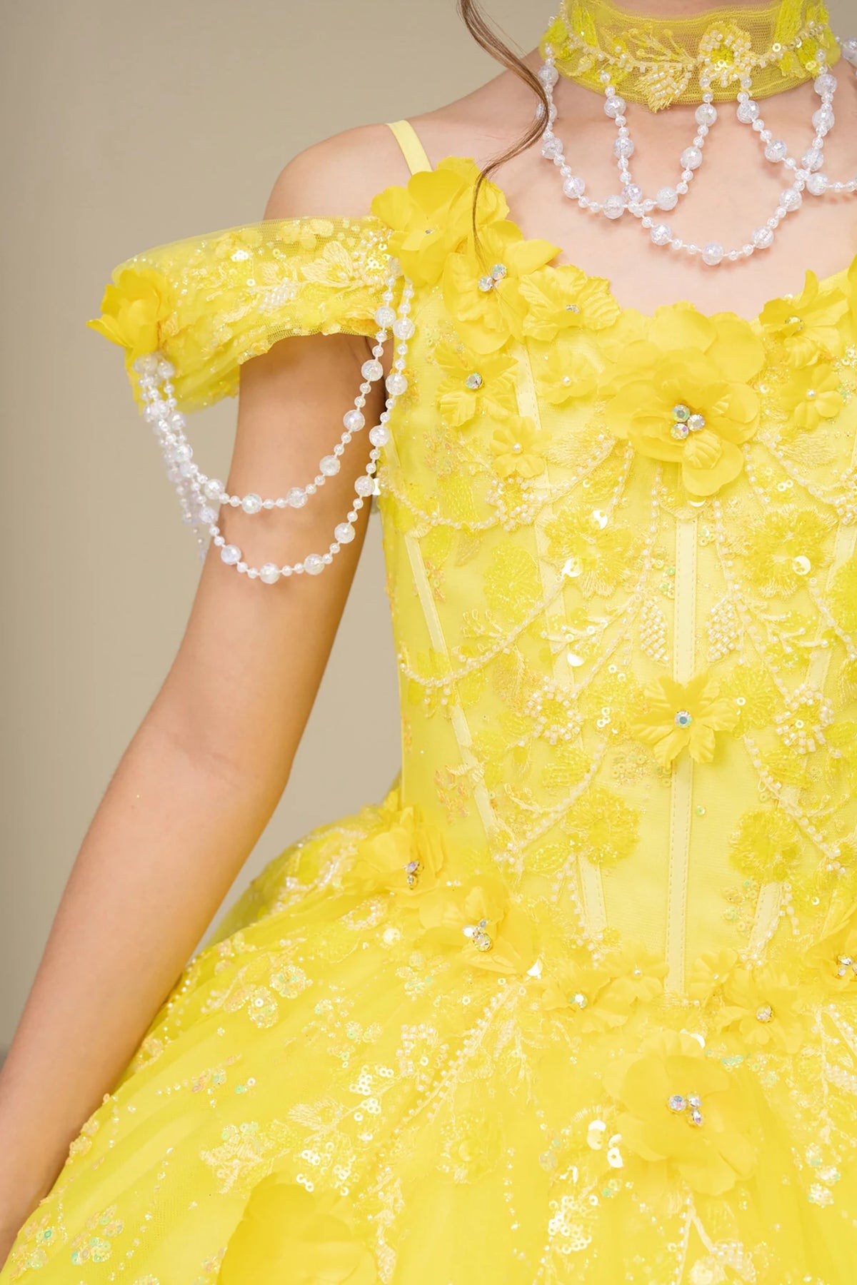 Yellow front view kids mini quinceañera mini quince dress with floral lace, pearl details and glitter tulle skirt.