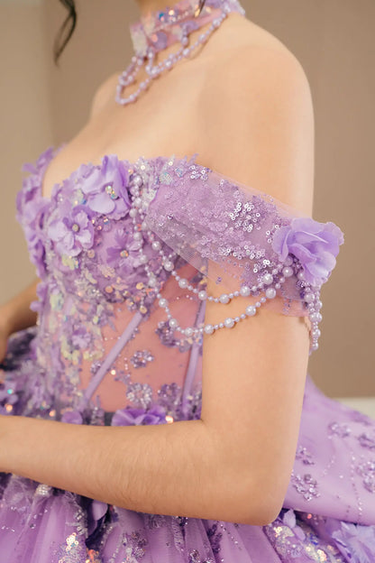 Side close-up view of a woman wearing lilac quinceañera dress highlighting layered glitter tulle, sweetheart neckline, and embellished bodice.