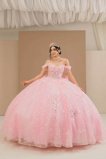 Full front view of a woman wearing pink quinceañera dress with glitter tulle skirt, off-shoulder sweetheart neckline, and beaded corset bodice.