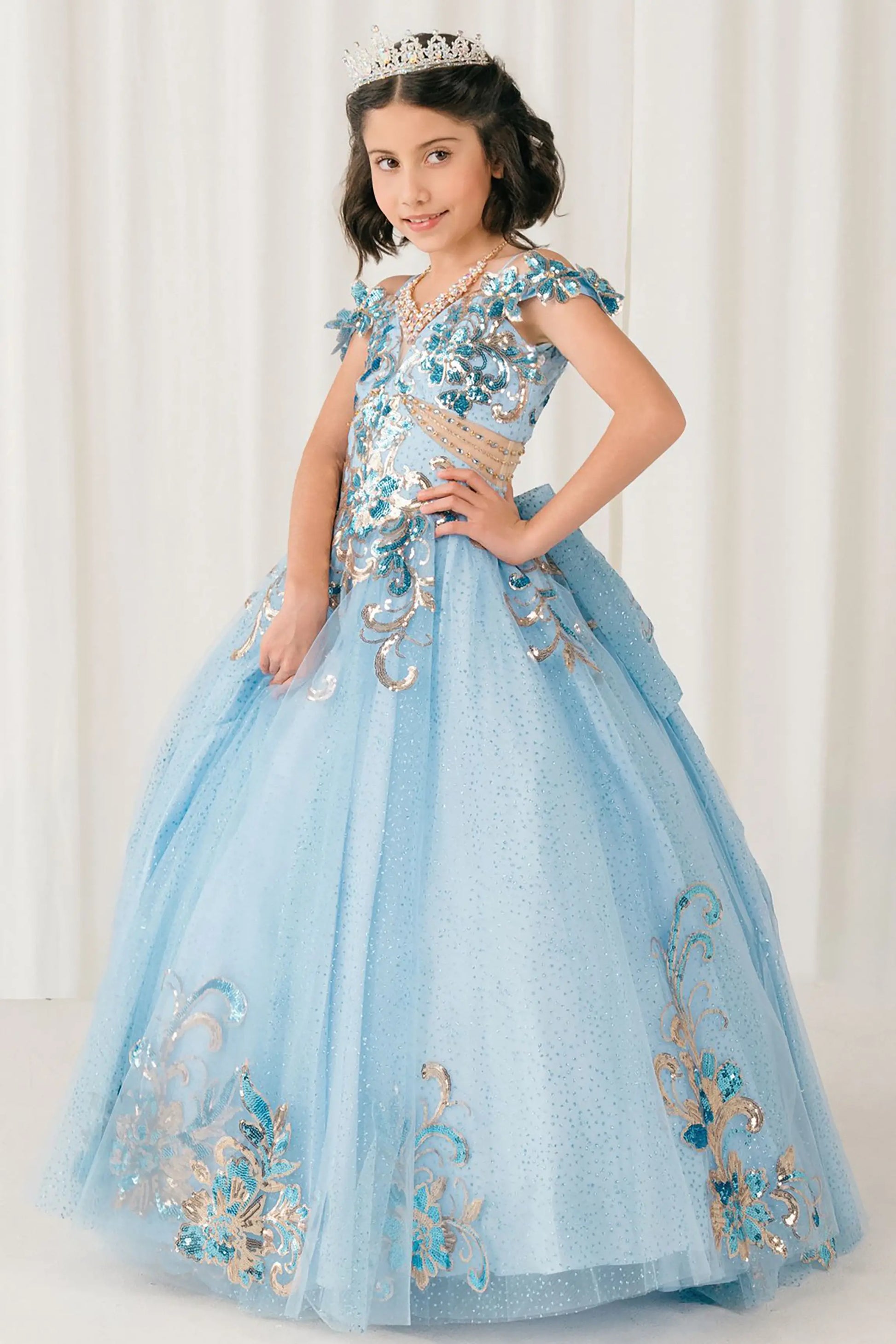 Front full-length view of Blue mini quince ball gown with off shoulder floral embroidered bodice, glitter tulle skirt, lace up back, and layered bow