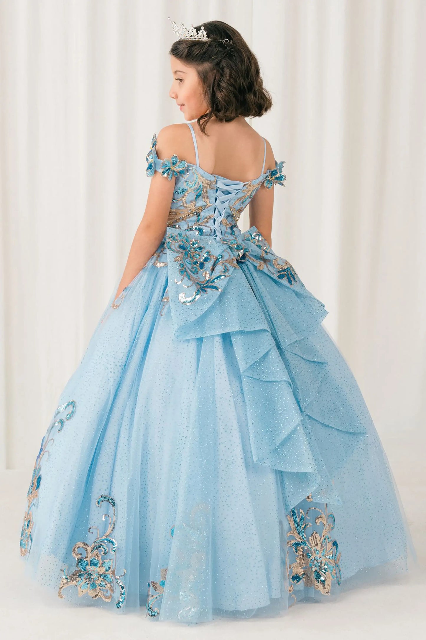Black full-length view of Blue mini quince ball gown with off shoulder floral embroidered bodice, glitter tulle skirt, lace up back, and layered bow