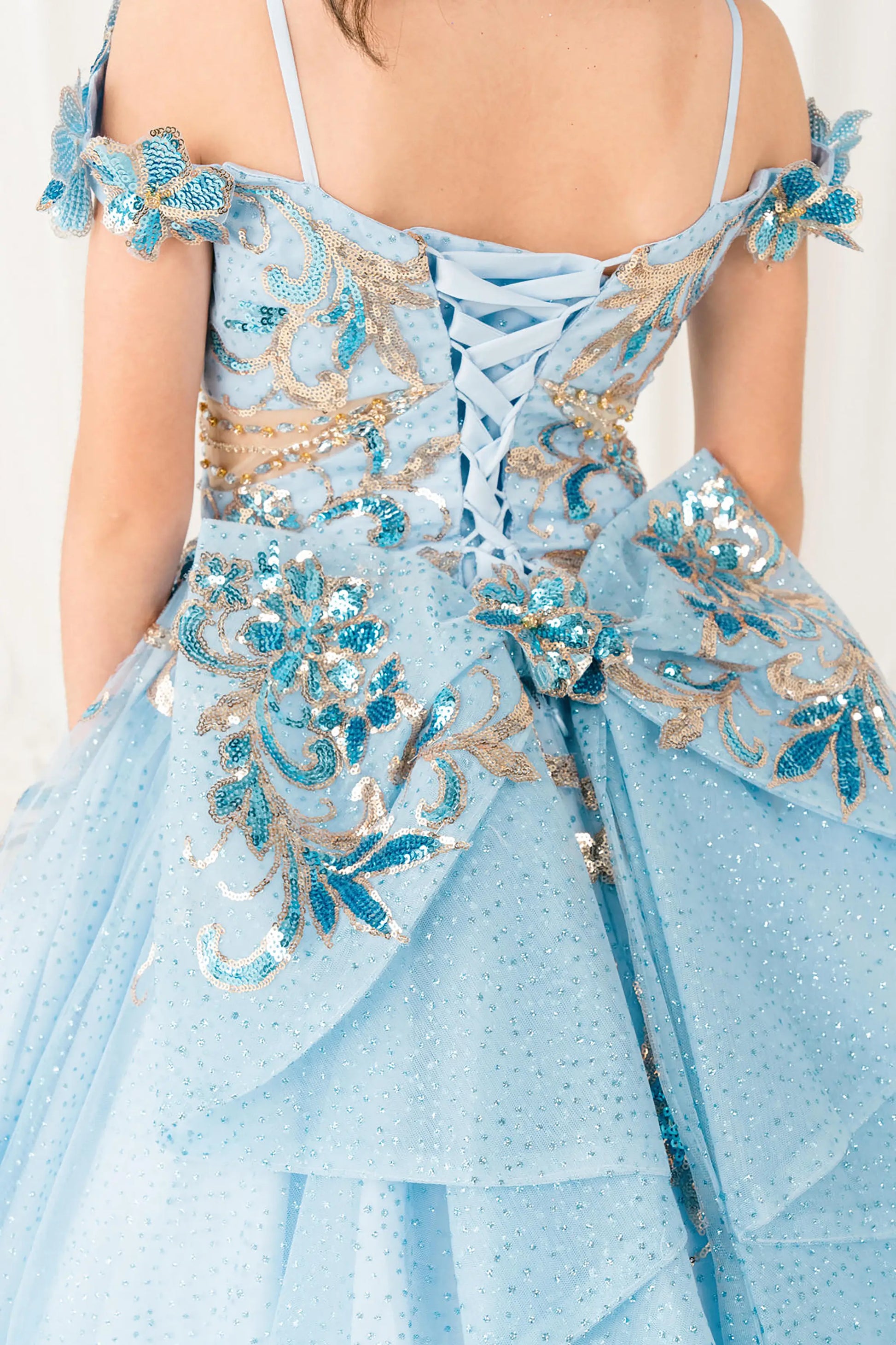 Black Close Up Blue mini quince ball gown with off shoulder floral embroidered bodice, glitter tulle skirt, lace up back, and layered bow