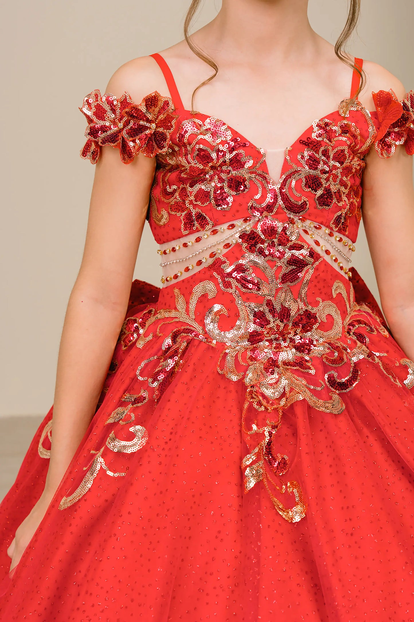 Front close up view of Red mini quince ball gown with off shoulder floral embroidered bodice, glitter tulle skirt, lace up back, and layered bow