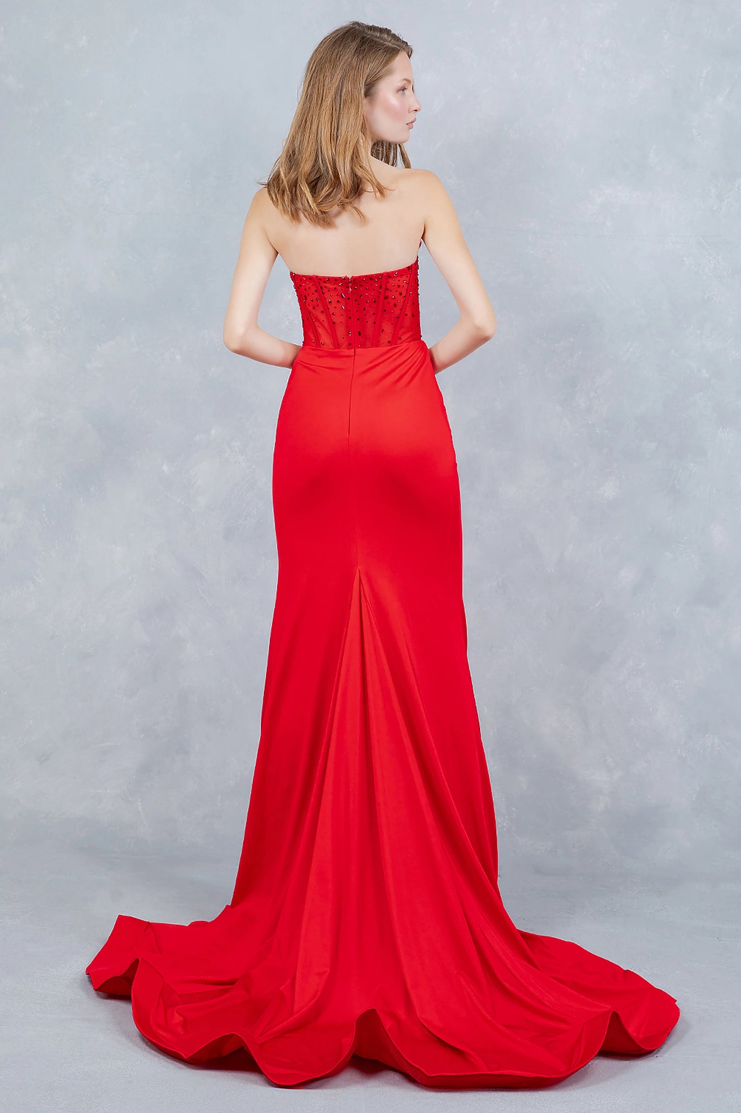 Red prom dress designed with zipper back closure