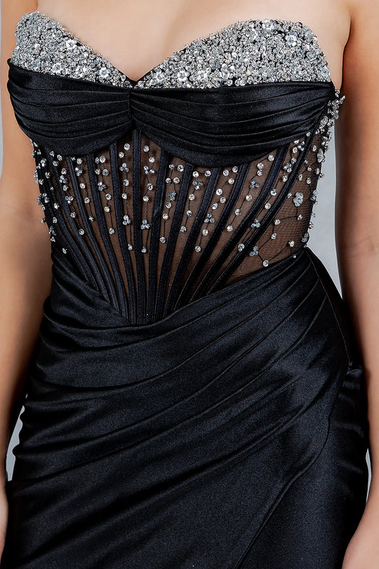Black Evening dress featuring sheer corset panel with radiating boning elongating the torso