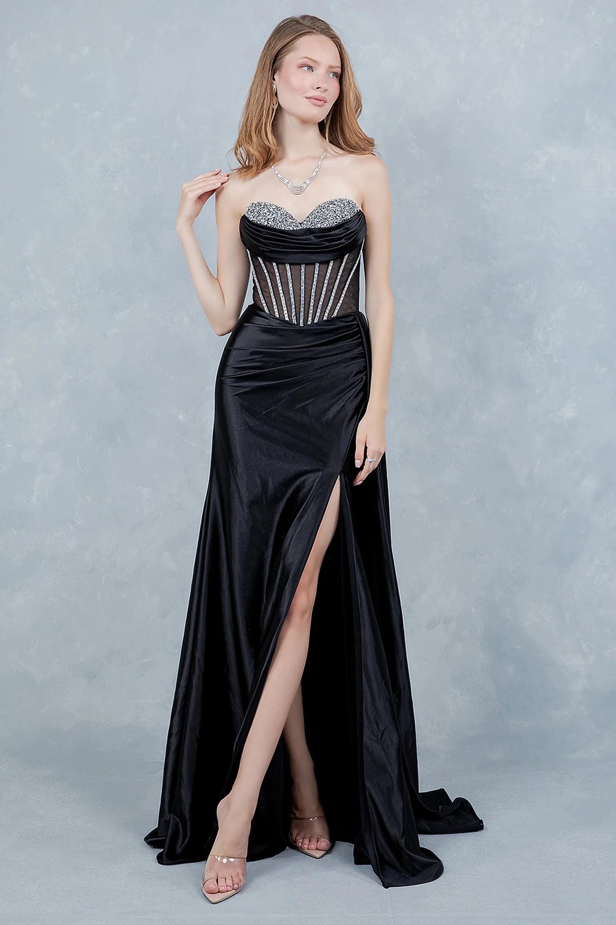 Black evening gown with strapless sweetheart bodice embellished in sparkling rhinestones