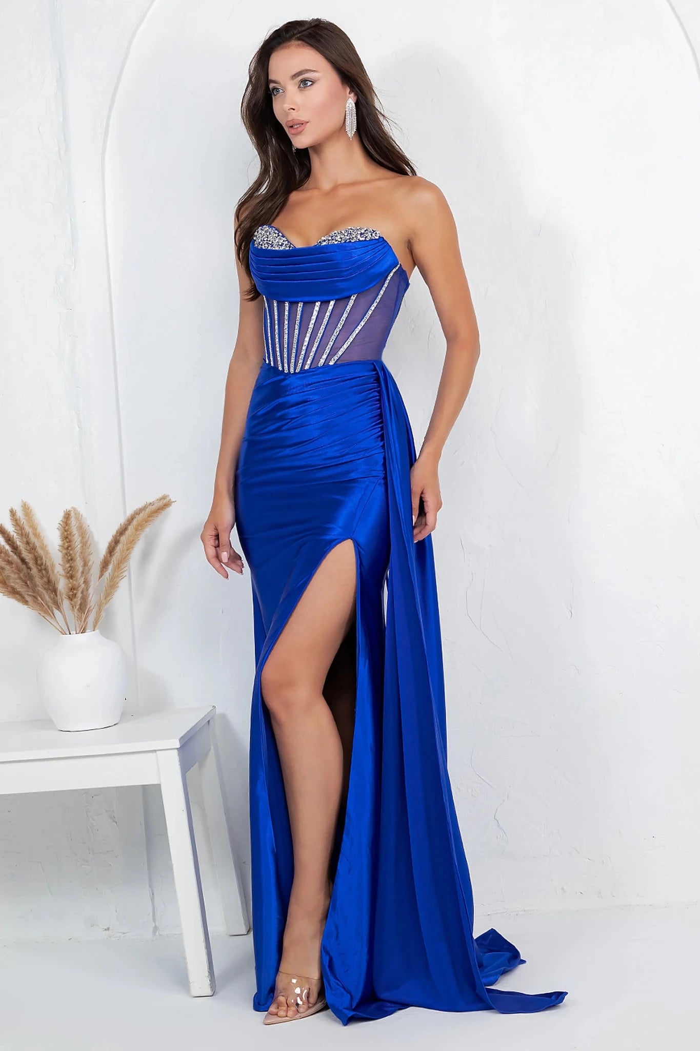 Royal Blue evening gown completed with flowing satin train adding sophistication and sheen