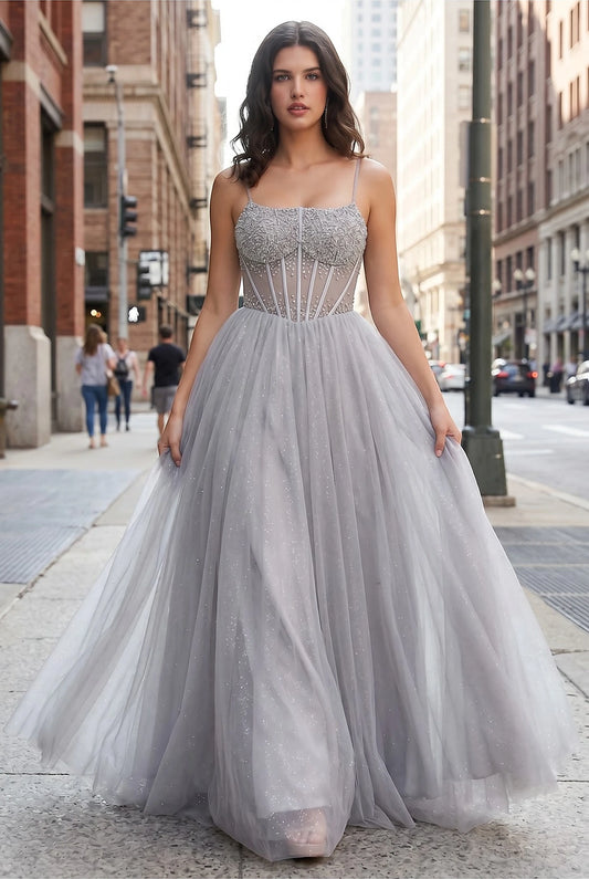 Silver evening dress showcasing voluminous tulle skirt sparkling like midnight sky