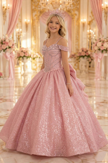 Displayed in a angled view, the Rose Gold mini quince dress has off-shoulder straps and flared glitter ball skirt.