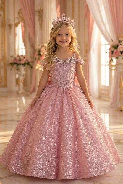 Kid wearing rose gold mini quince dress front-facing with shimmering ball gown skirt, corset bodice, and elegant silhouette