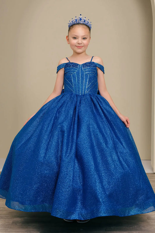 Kid standing front-facing in enchanting royal blue ball gown with oversized tiered bow accent, fitted bodice, and voluminous layered skirt


