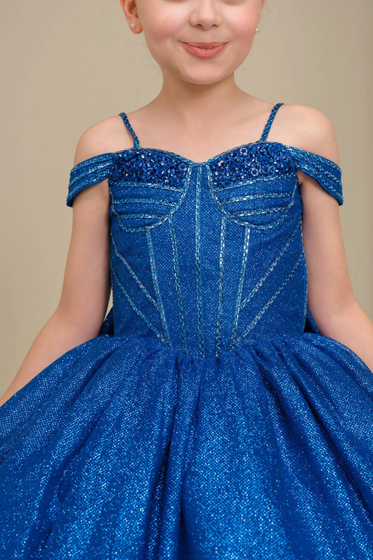 Close-up front-facing view of royal blue ball gown with embellished bodice and oversized tiered bow accent

