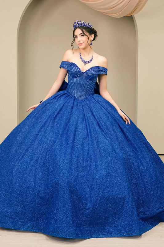 Woman standing front-facing in elegant royal blue ball gown with beaded corset bodice and voluminous glitter tulle skirt

