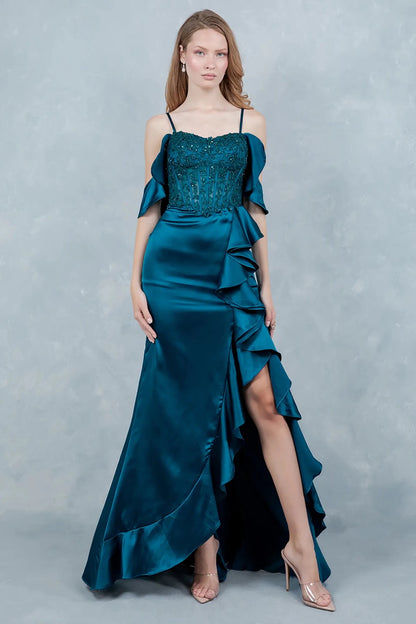 A full-length view of a woman wearing blue formal dress with a graceful train.