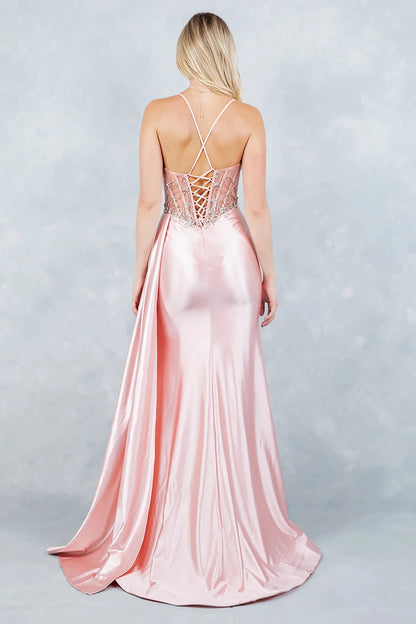 Full back view of blush formal dress with lace-up corset and flowing train.