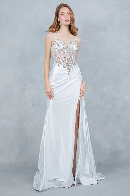 Full front view of a women wearing silver satin prom dress with sheer corset bodice and slit.