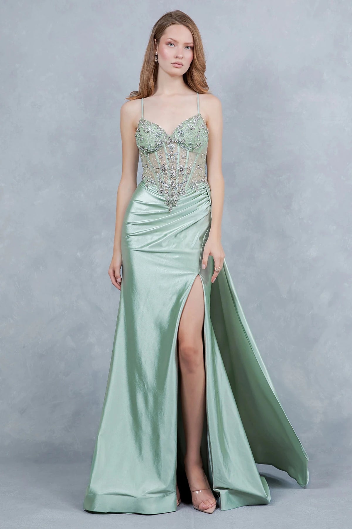 Sage prom dress showcasing daring thigh-high slit adding modern elegant allure