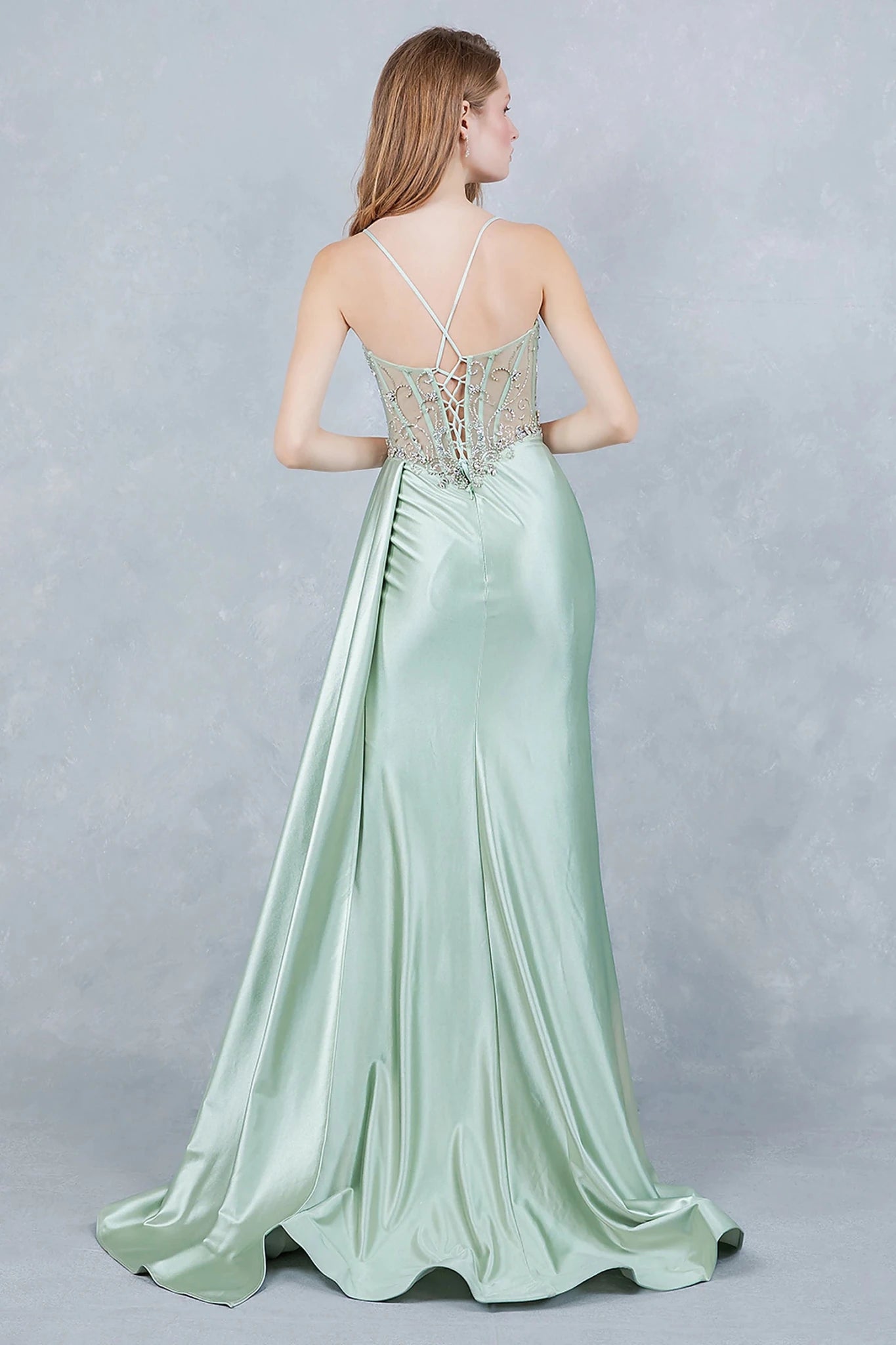 Sage prom dress featuring thin straps framing neckline with lace-up back for custom fit