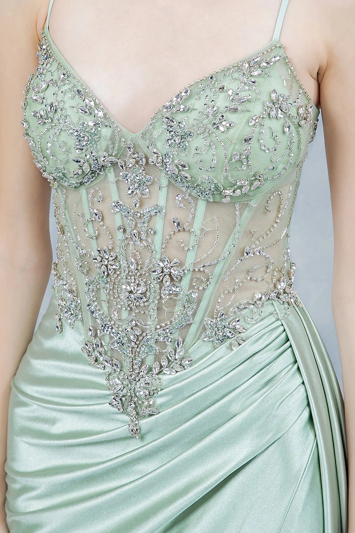 Sage prom dress with sheer corset-style bodice embellished in beadwork and embroidery