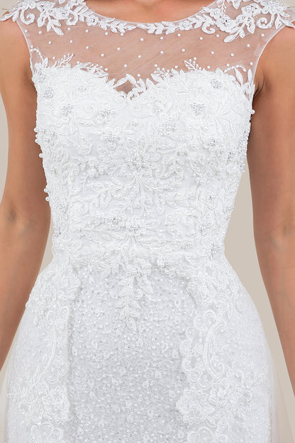 White lace dress with intricate detailing on a neutral background