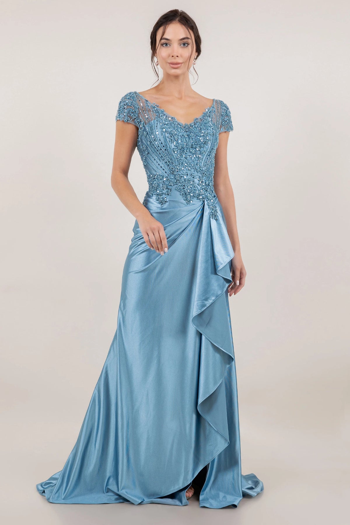 Refined Dusty Blue satin mother of the bride mermaid dress features a beaded bodice and cascade ruffle.