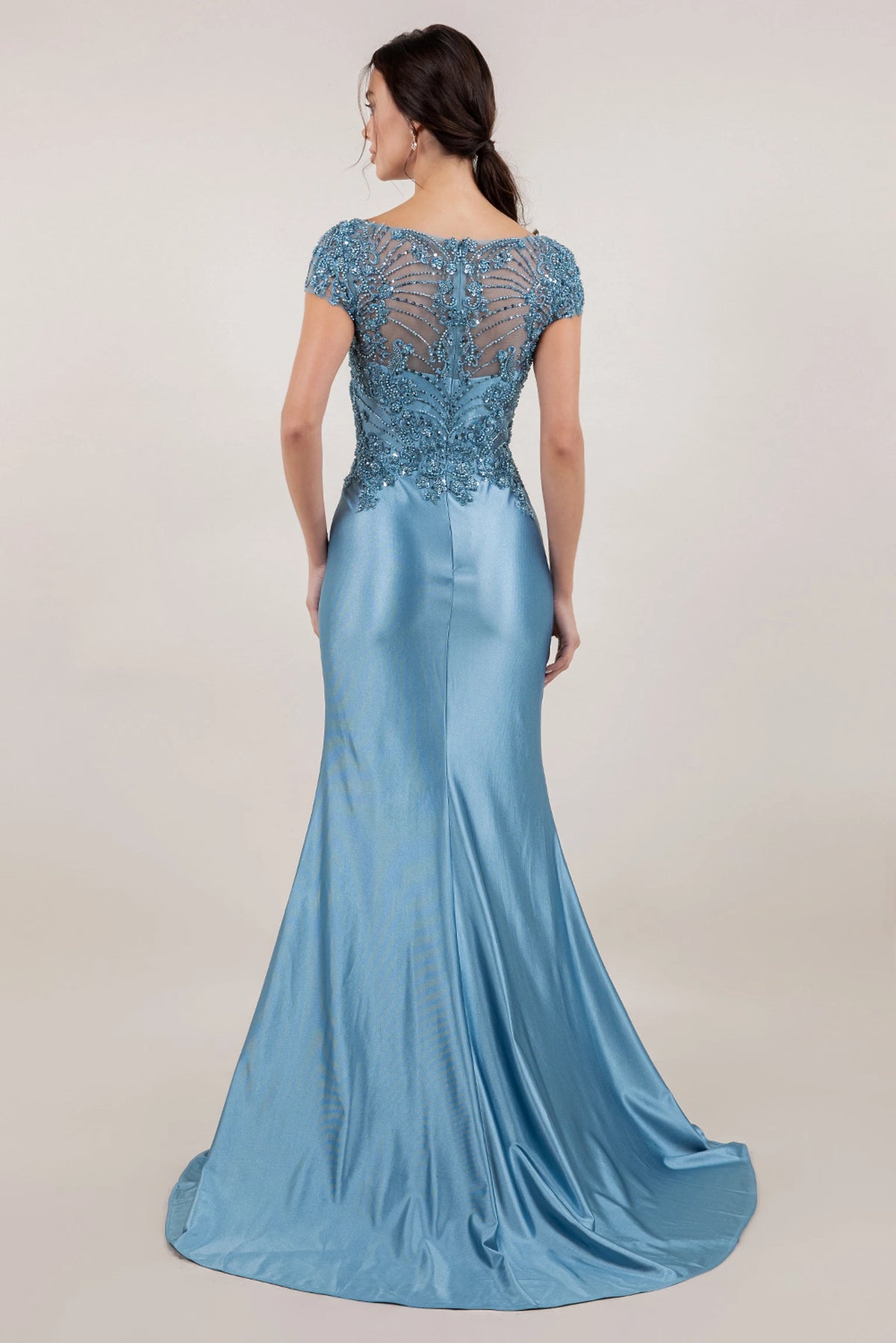 Rear detailing on the Dusty Blue mother of the bride dress shows sheer lace above a satin train.