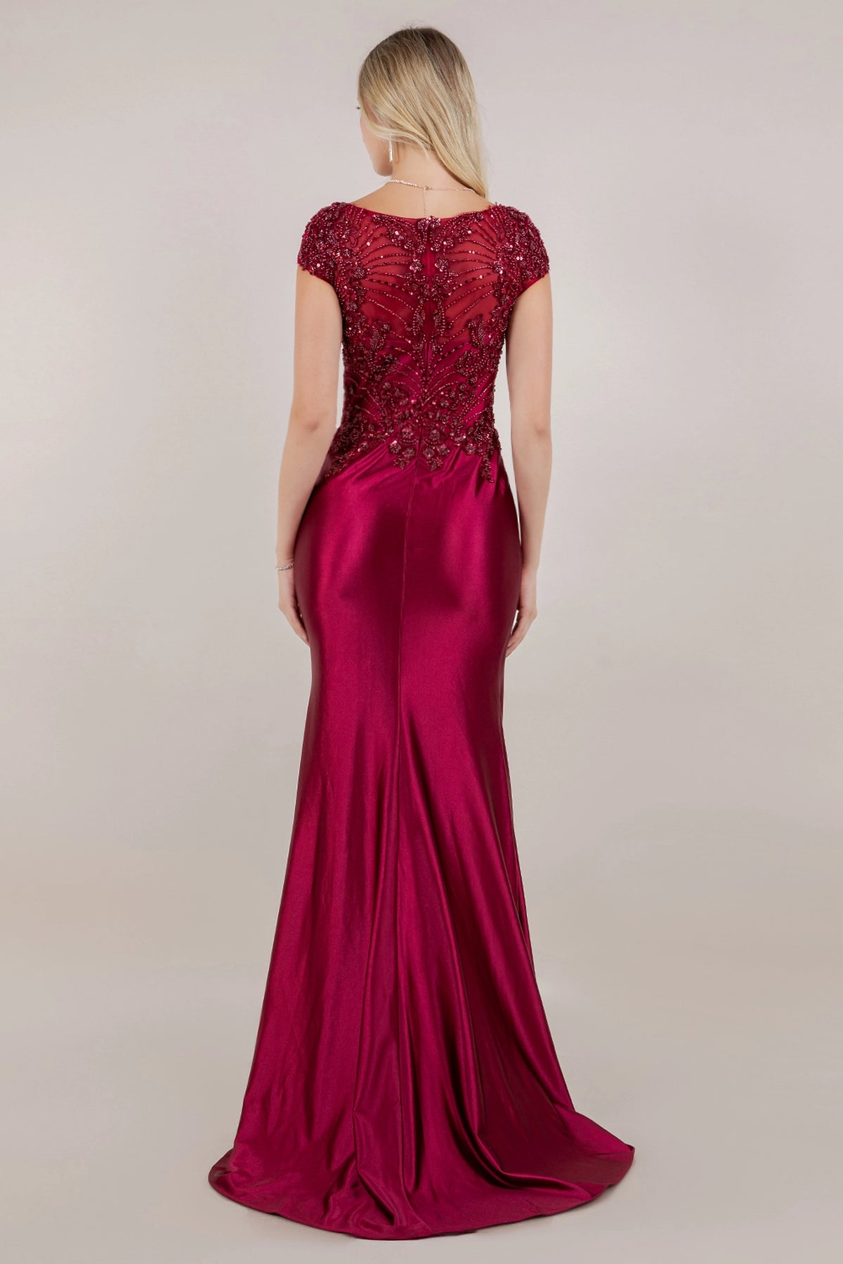 Behind the Wine mother of the bride dress, sheer lace continues above the smooth satin train.
