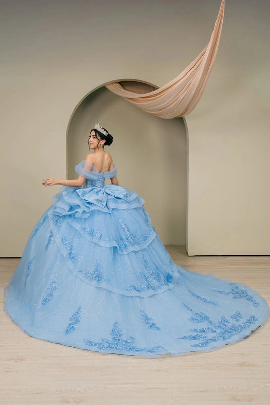 Sweeping tulle train with lace appliqués on the Blue quinceañera dress.