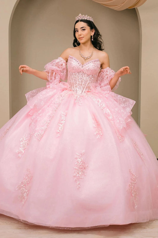 Woman wearing pink off-shoulder sweetheart quinceañera dress with beaded embroidered corset bodice and layered tulle organza full skirt