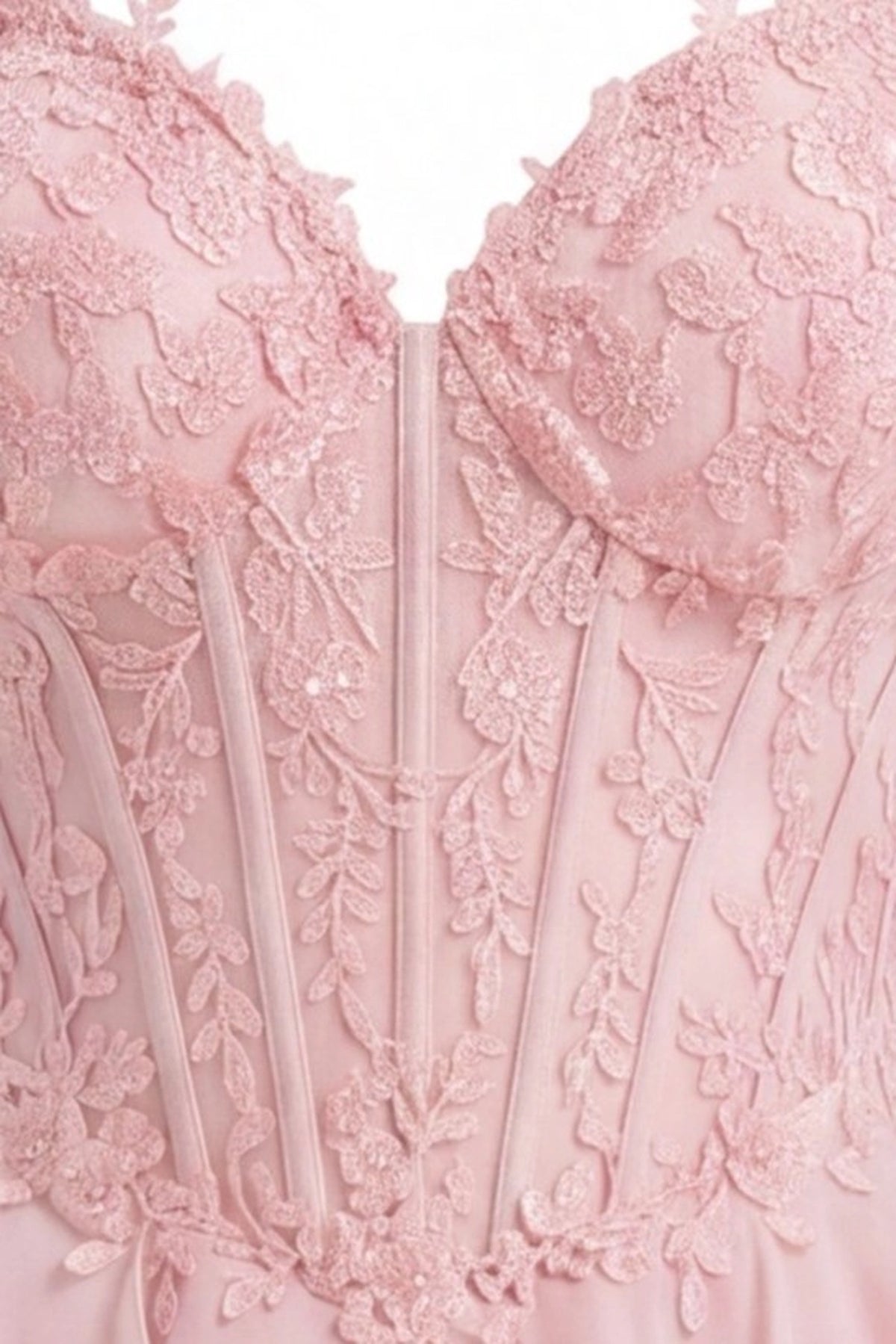 Detail of this Pink prom and evening dress shows floral lace and beadwork.