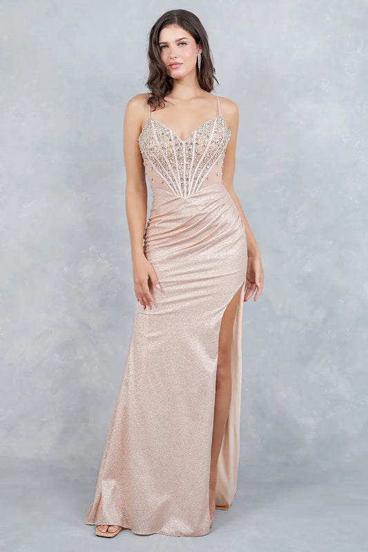 Full front view of a women wearing rose gold glitter knit prom dress with crystal corset bodice and slit.