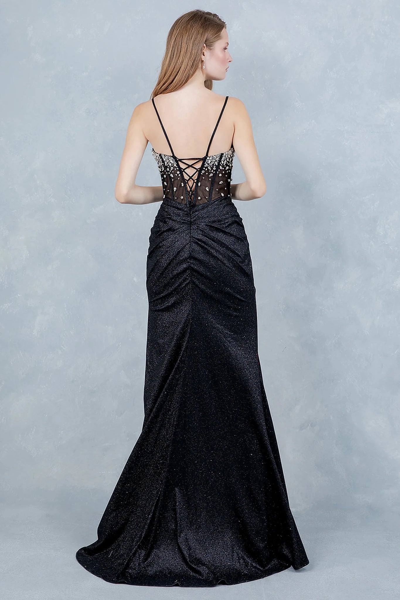 Black evening gown showcasing lace-up back with delicate spaghetti straps