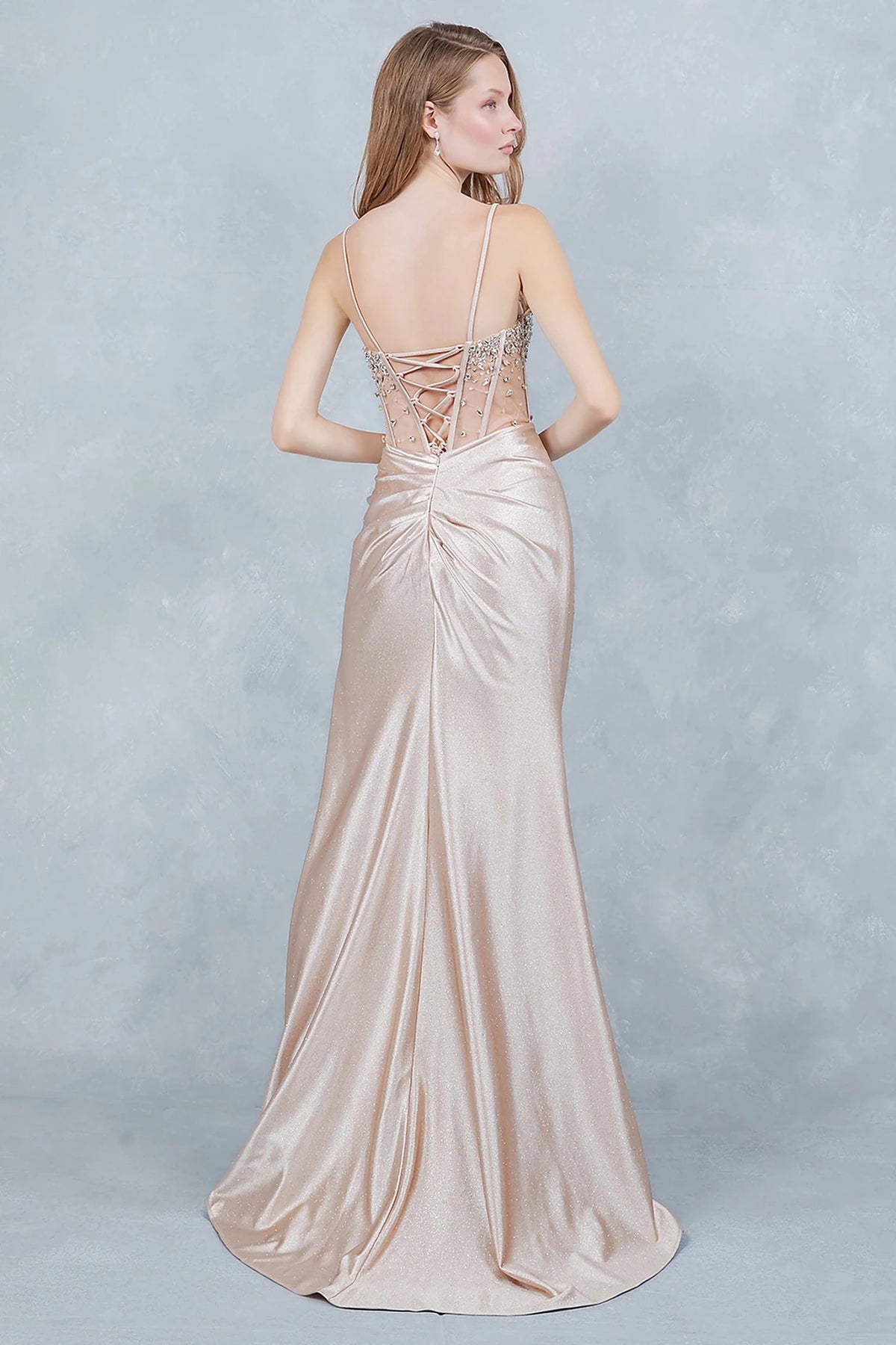 Champagne evening gown showcasing lace-up back with delicate spaghetti straps