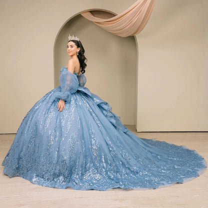 Woman wearing dusty blue off-shoulder sweetheart quinceañera dress side-facing with beaded sequin bodice, voluminous tulle skirt, and flowing sleeve accents