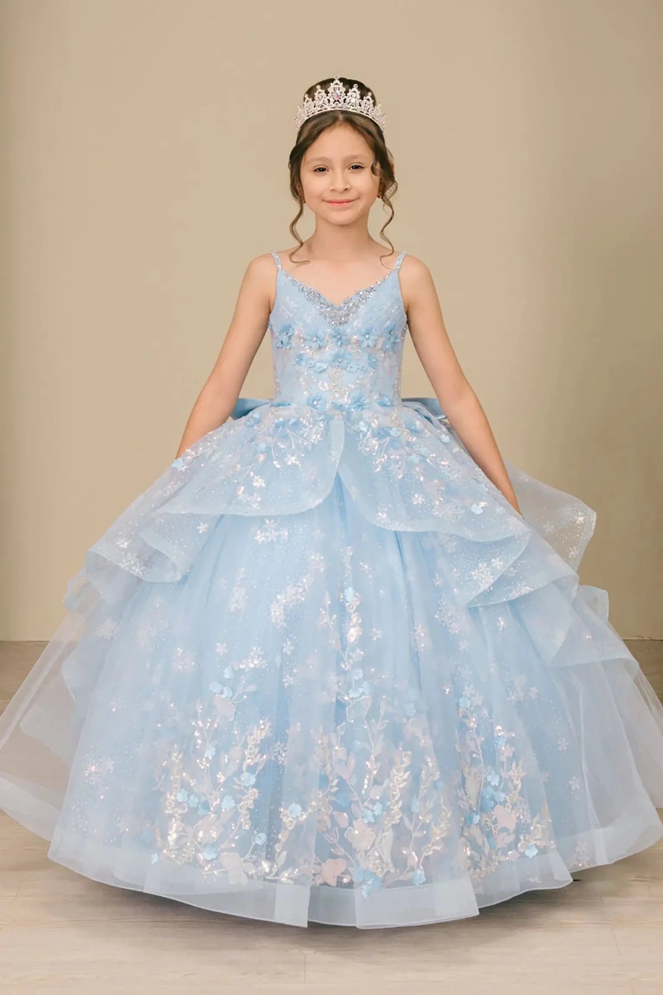 Front view of mini quinceañera mini quince dress with V-neck corset bodice, sequin floral embroidery, and layered skirt.