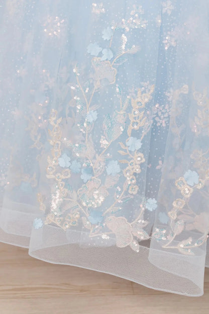 mini quinceañera ball gown with V-neck corset bodice, sequin floral embroidery, and dramatic oversized bow at back