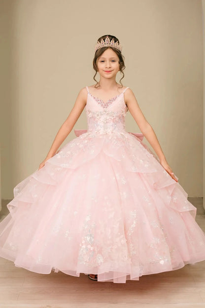 Young girl standing front-facing in mini quinceañera ball gown with V-neck corset bodice, sequin floral embroidery, and layered skirt