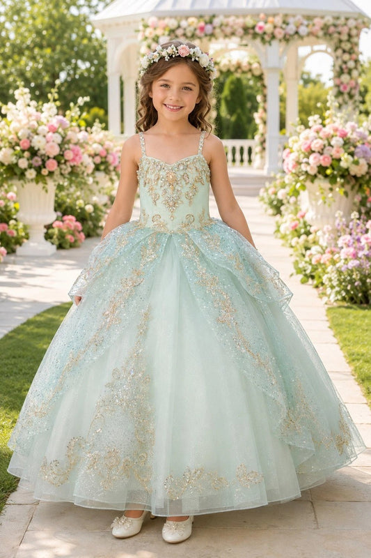Shown in a front view, the Sage mini quince dress has gold floral bodice and layered glitter tulle skirt.
