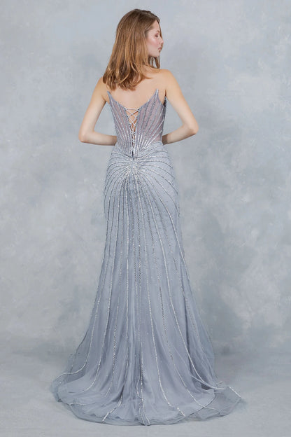 Detailed view highlights silver evening gown showcasing sunburst pattern extending across structured bodice and lace back up.