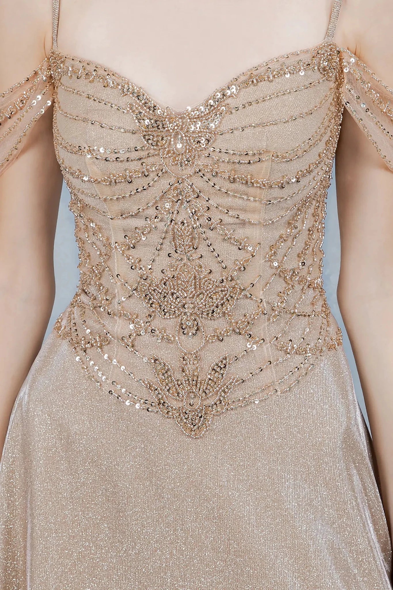 Champagne evening dress featuring beadwork and sequins in ornate motifs