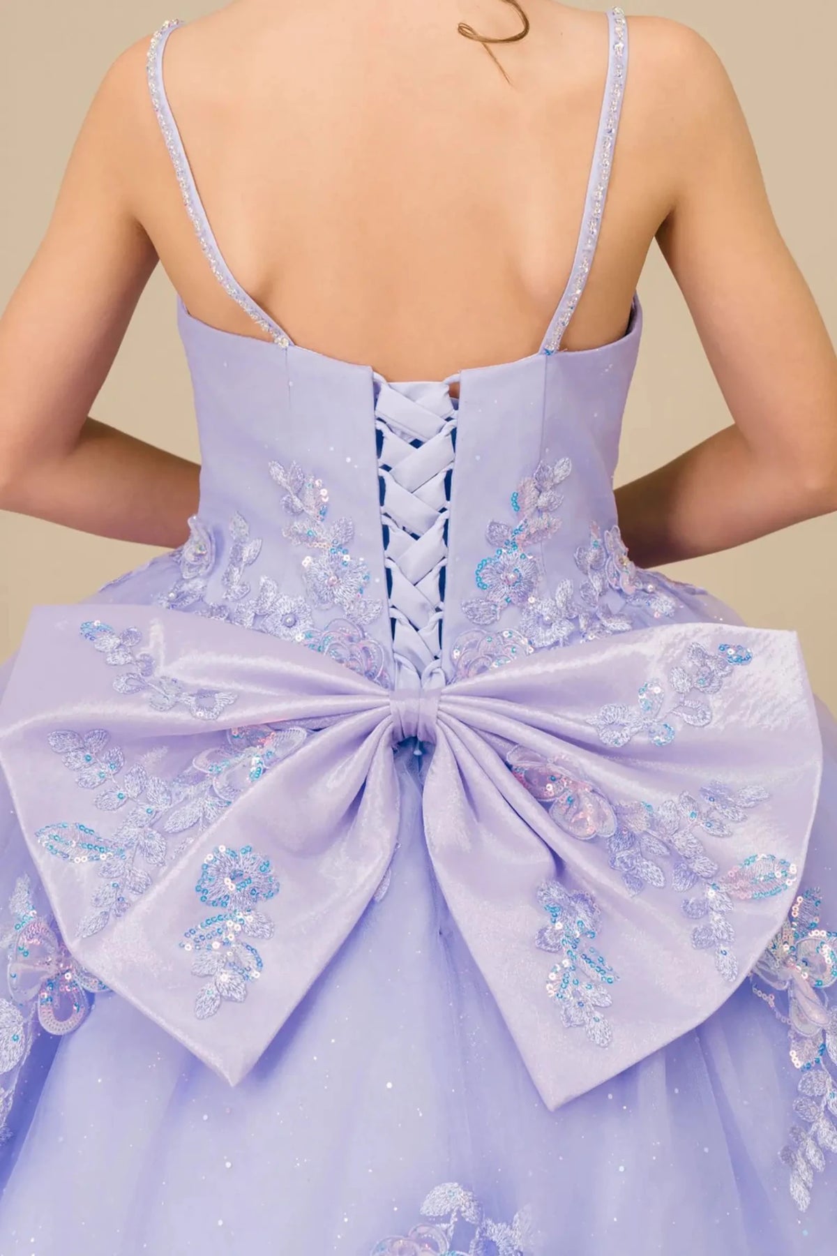 Textured details appear across Lilac mini quince dress with bodice back close-up of a lilac mini quinceañera mini quince dress.