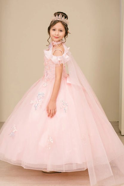 Side close-up view of a woman wearing pink mini quinceañera dress highlighting layered tulle skirt, ruffled off-shoulder sleeves, and sparkling embellished bodice.