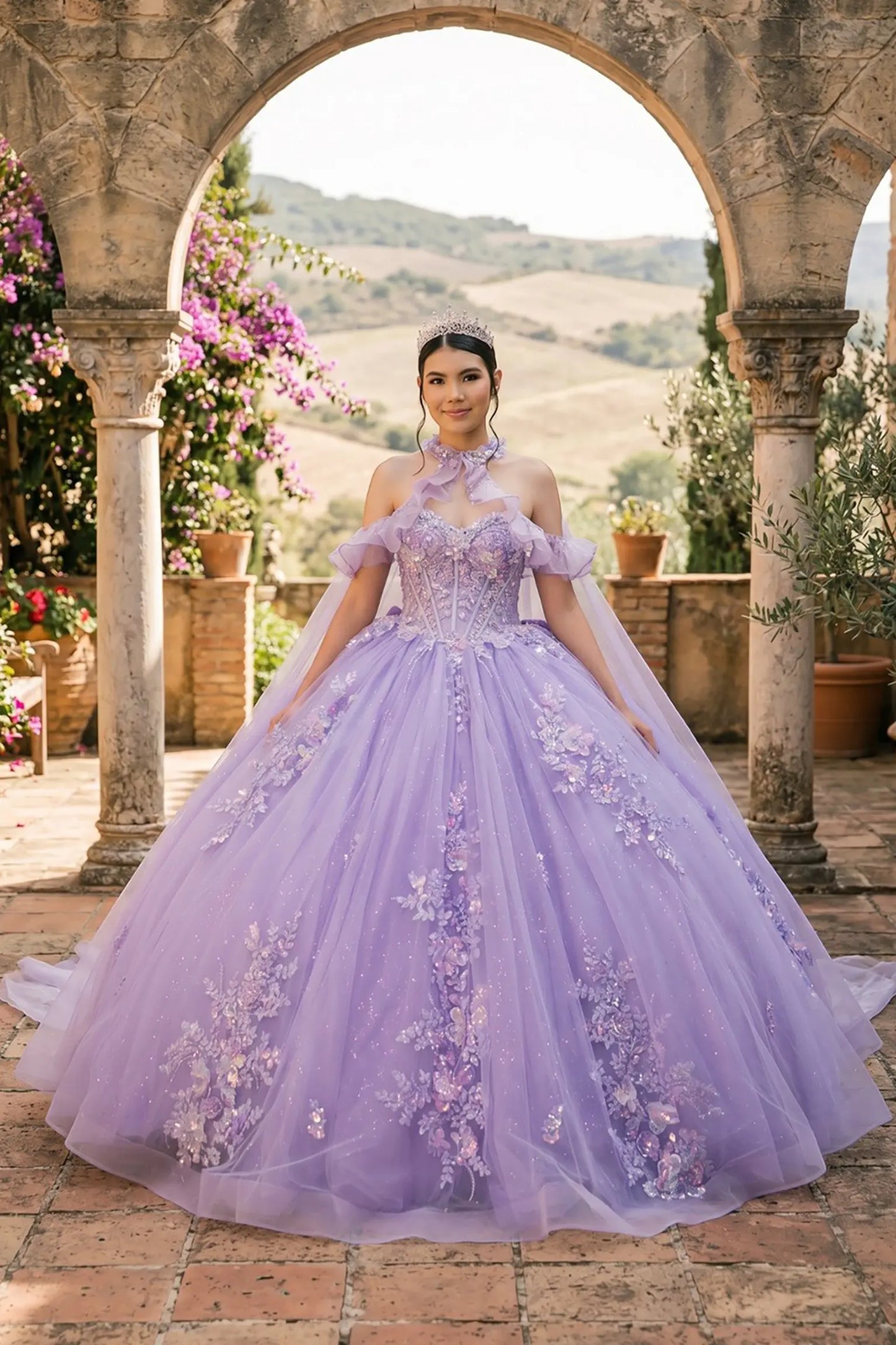 Full front view of a woman wearing lilac quinceañera dress with glitter tulle skirt, off-shoulder ruffled sleeves, and beadwork corset bodice.