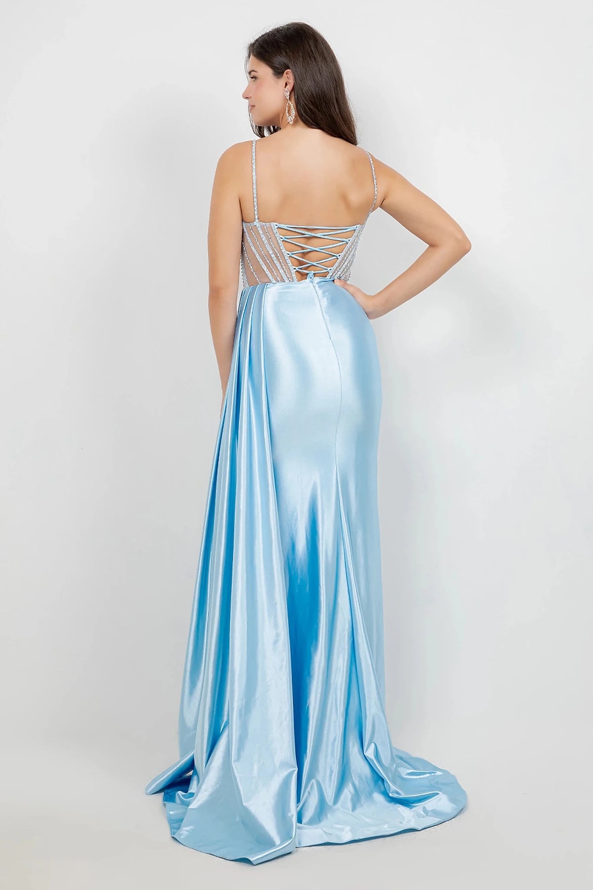 Blue evening gown styled with delicate spaghetti straps and lace-up back