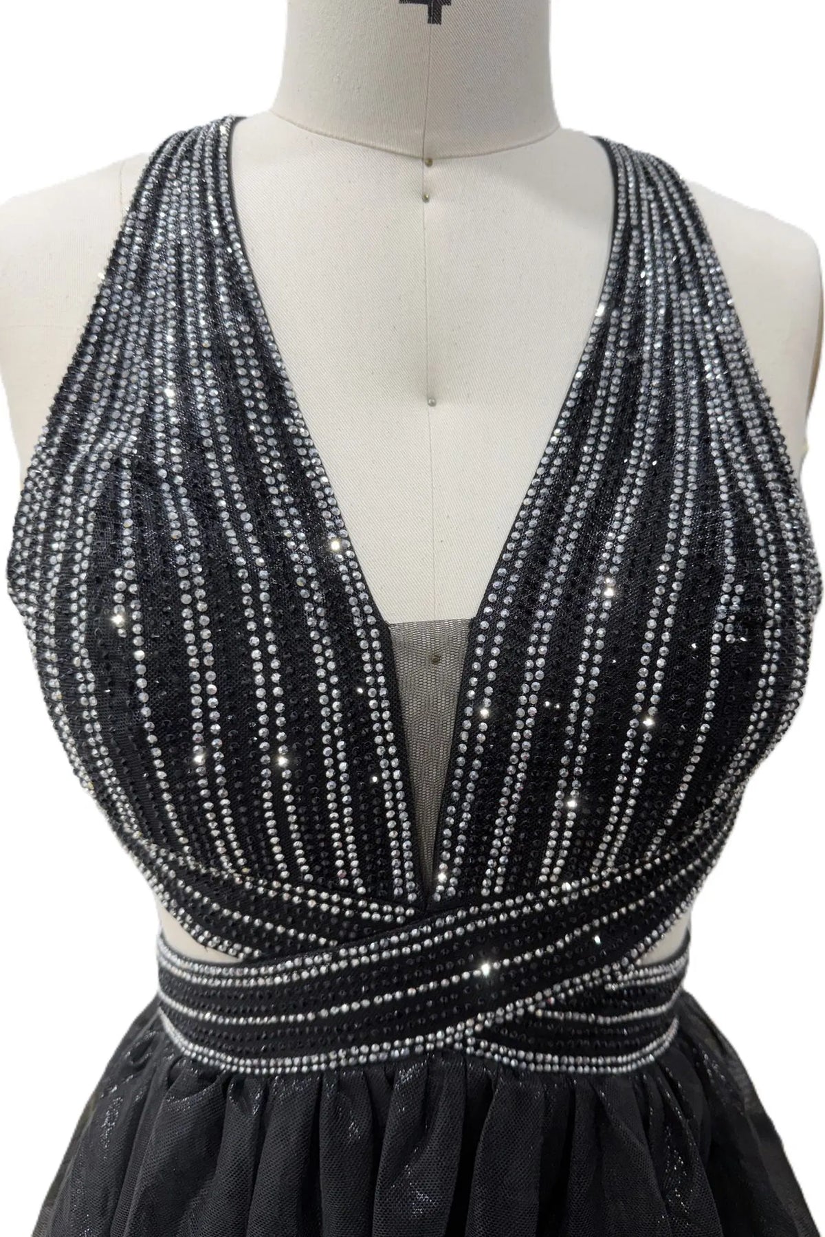 Detail of this Black prom and evening dress shows sparkling beadwork.
