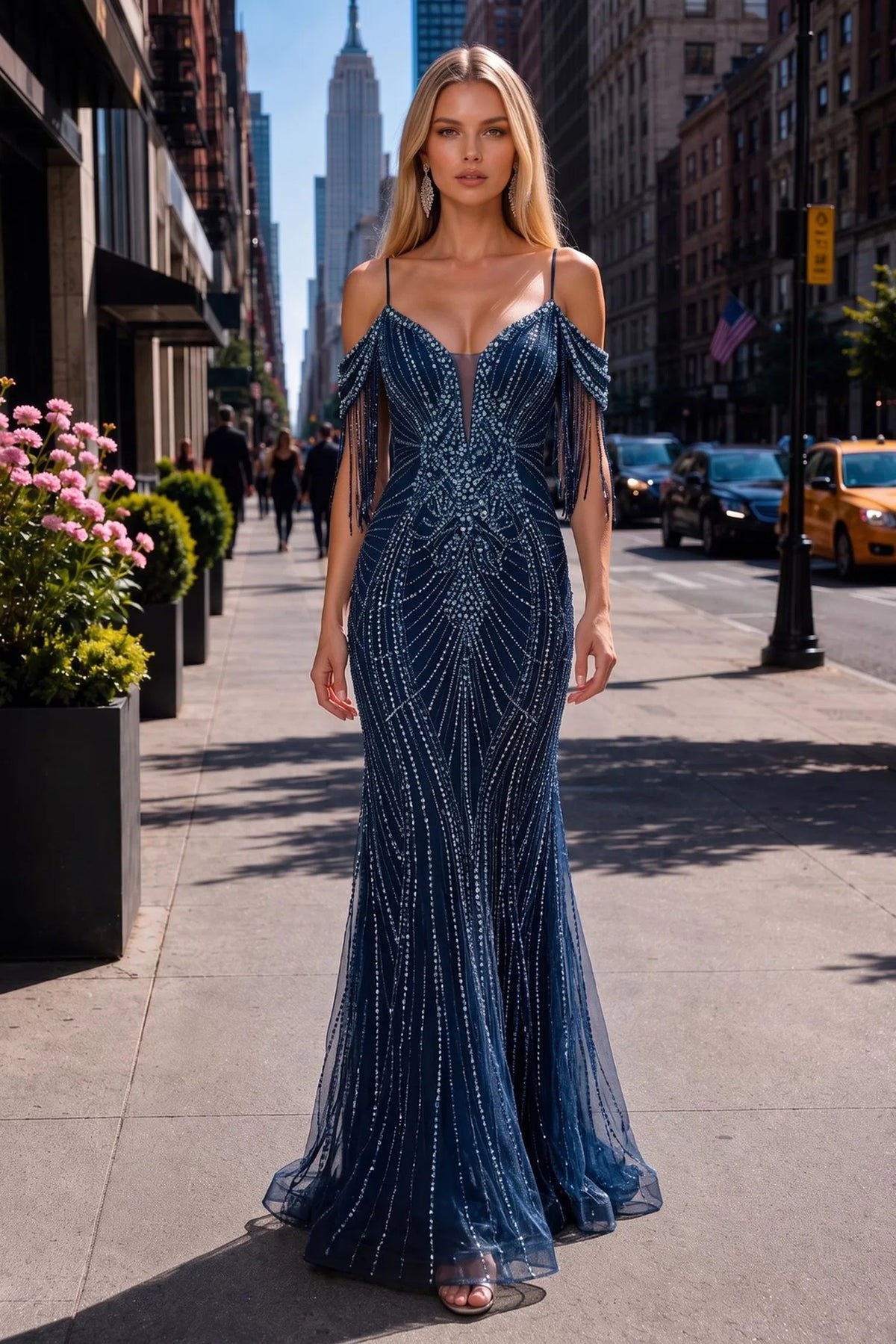 Navy prom and evening dress with a v-neck neckline and mesh skirt.